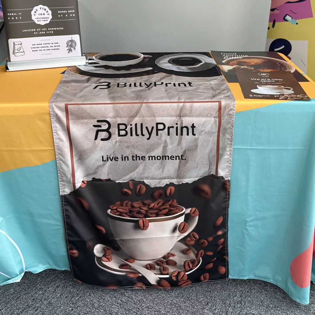 Custom table runner for trade show with logo and text design.