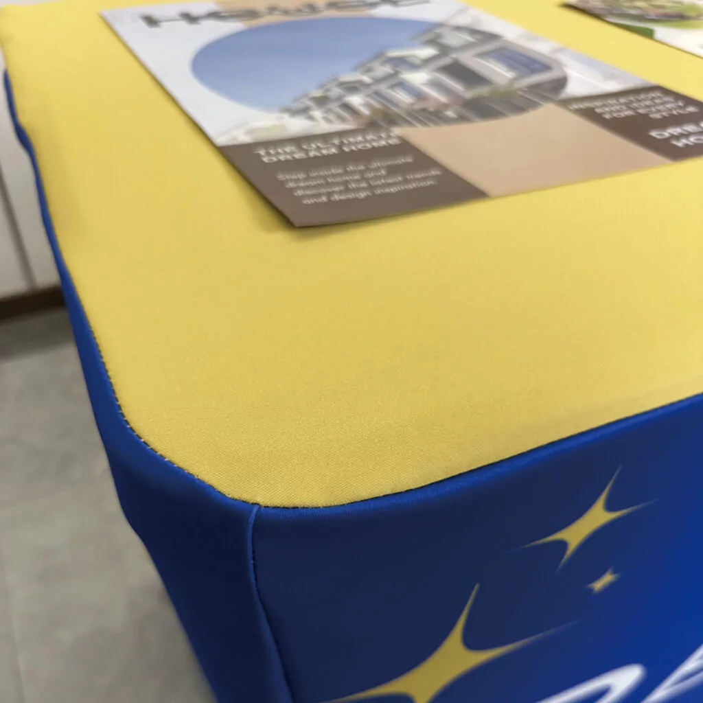 Close-up of elastic corner reinforcement inside custom size table covers for secure fitting.